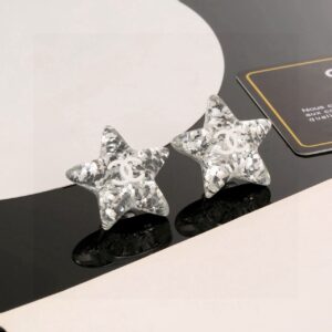 Chanel Acrylic Star Double C Earrings Silver Glitter Elegant Statement Design